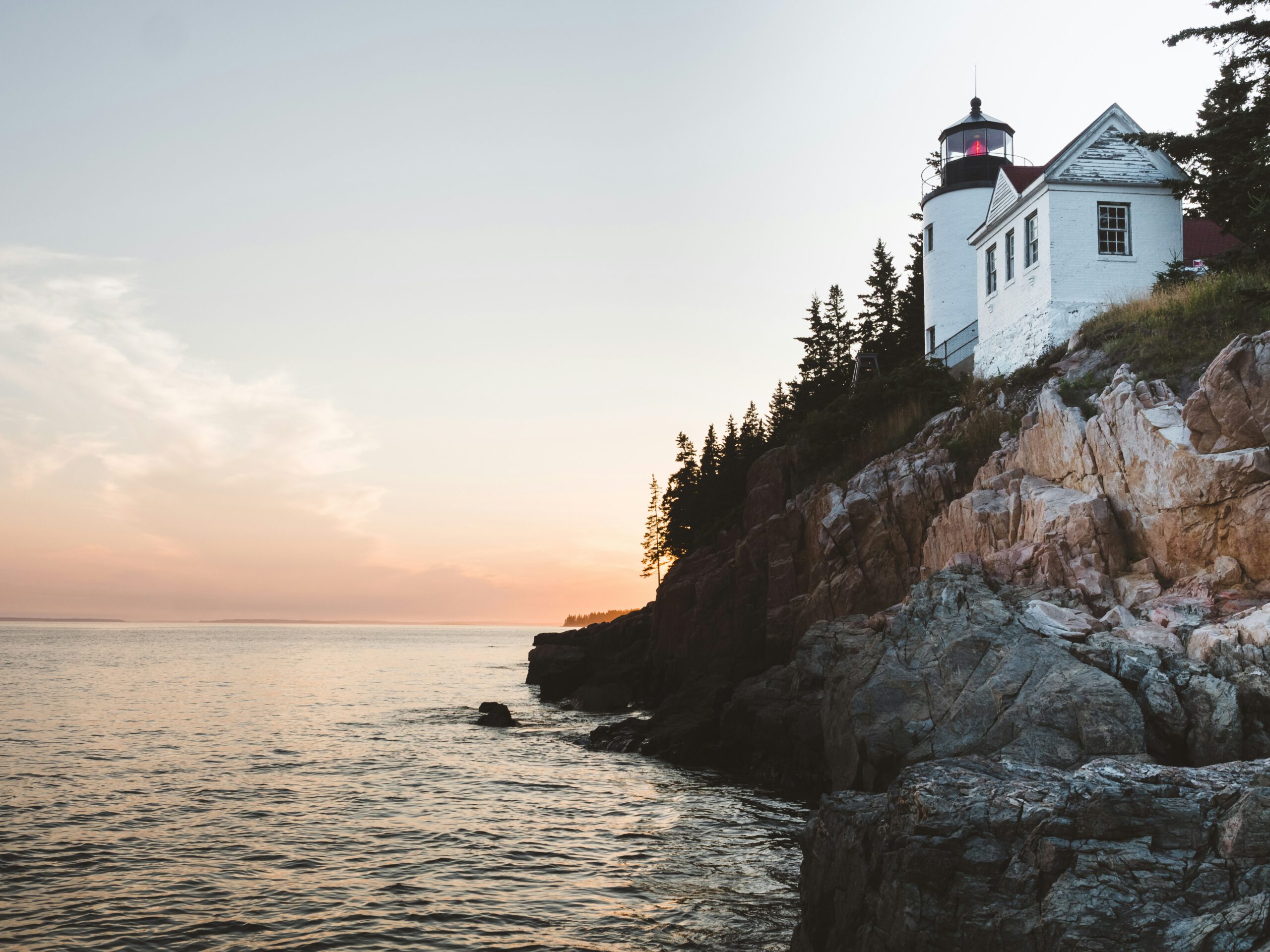 A lighthouse on the Maine coast at sunrise