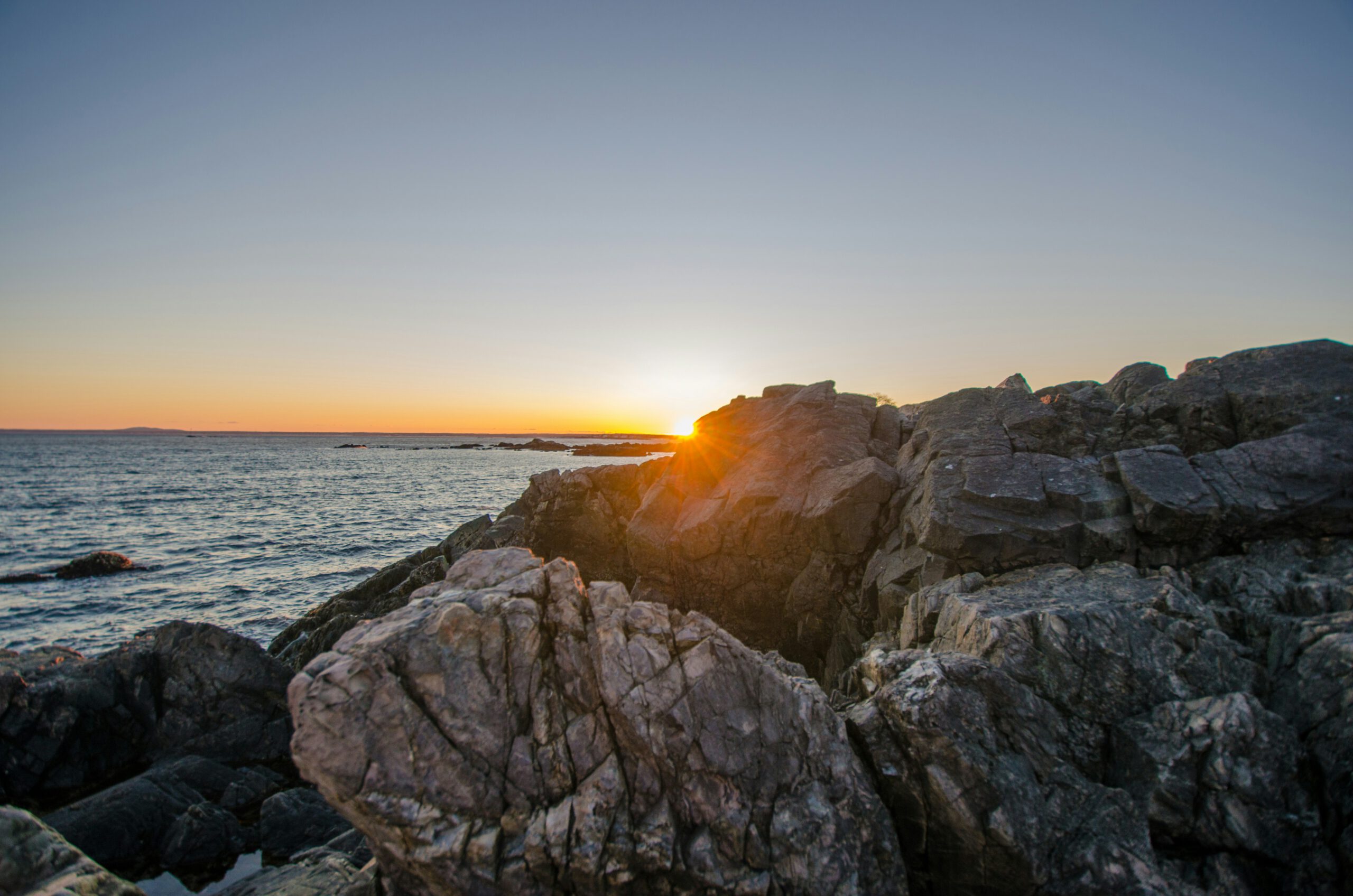 A sunrise over the rocky coast